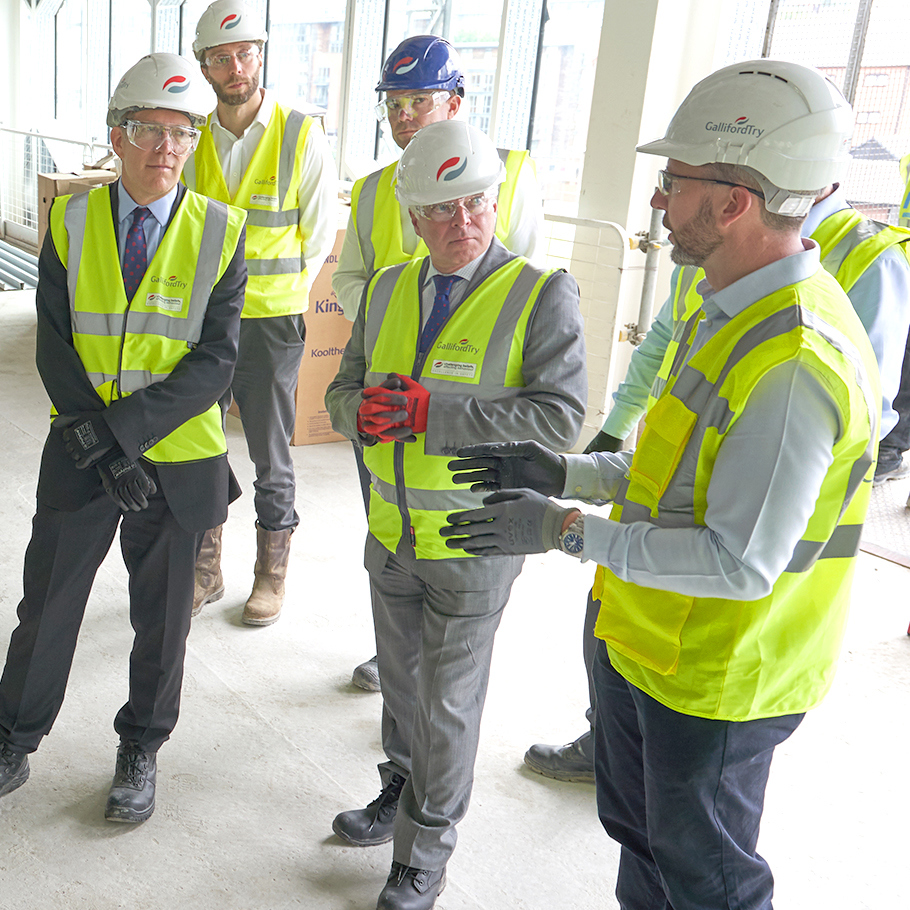 people in PPE on site visit