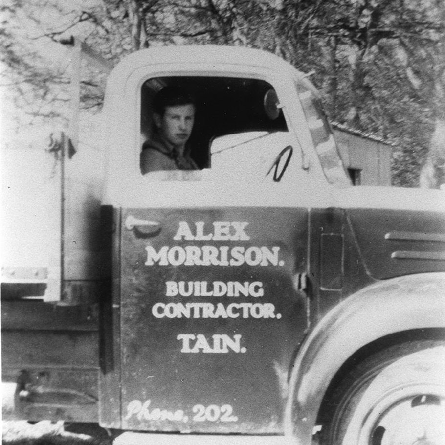 old image of a man in a truck