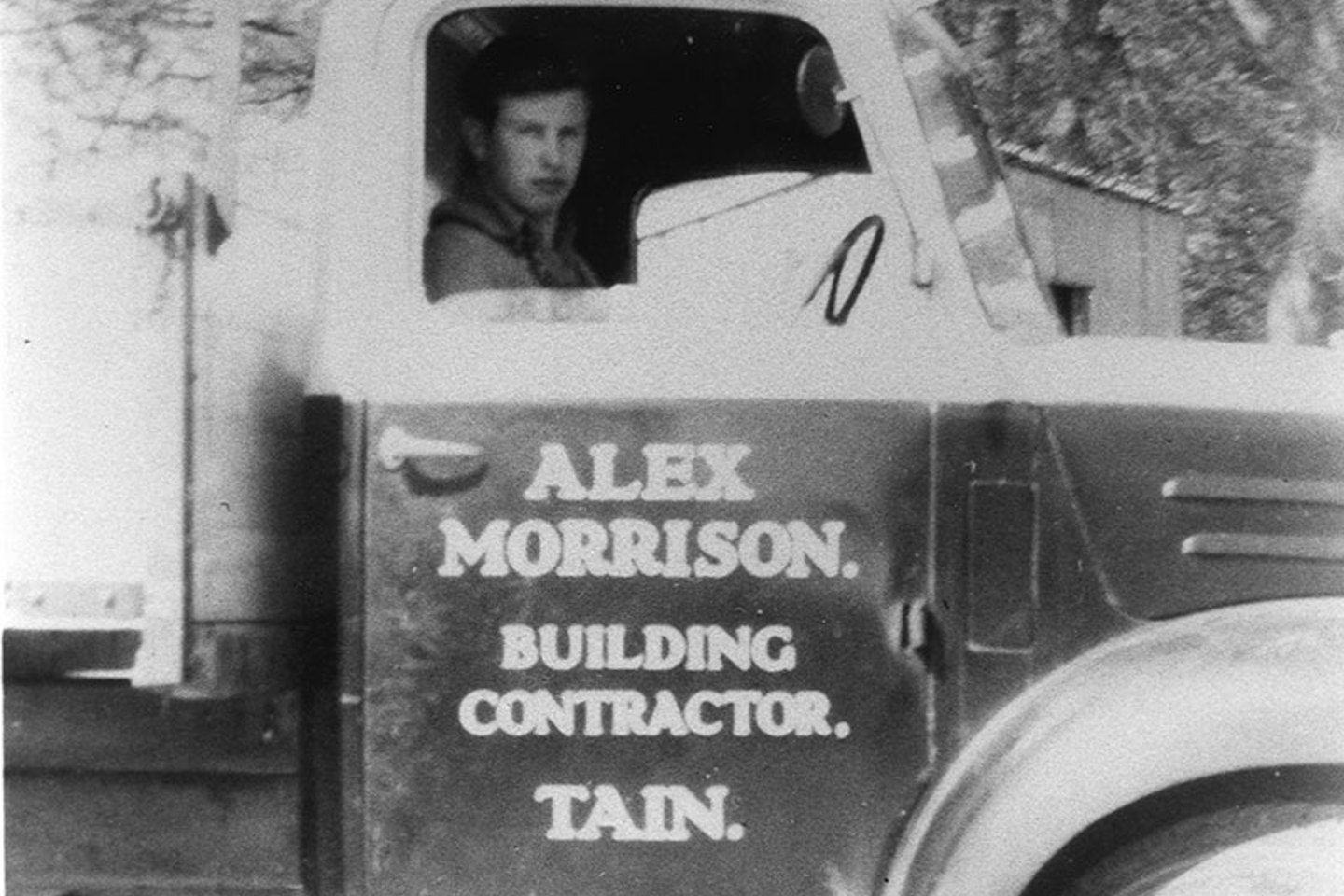 old image of a man in a truck