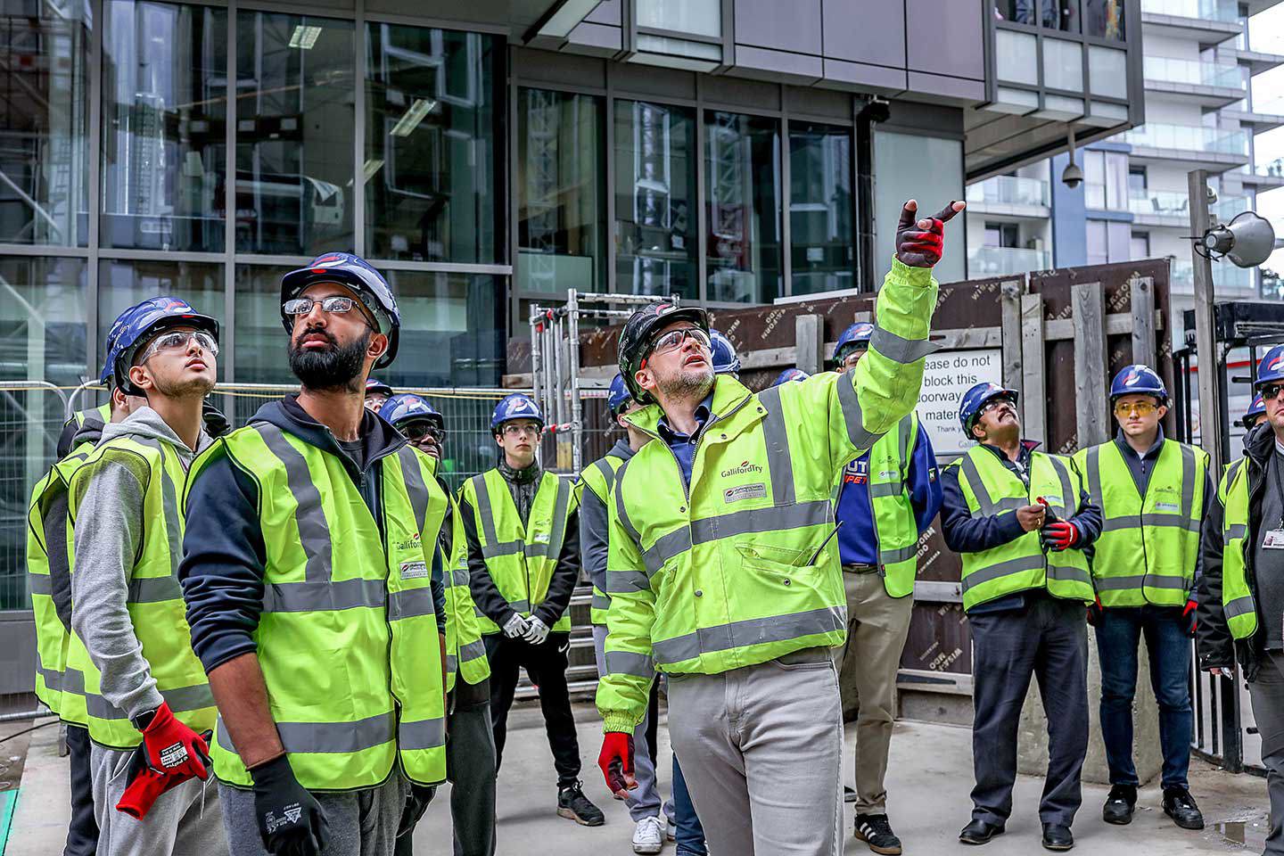 people in PPE on site visit