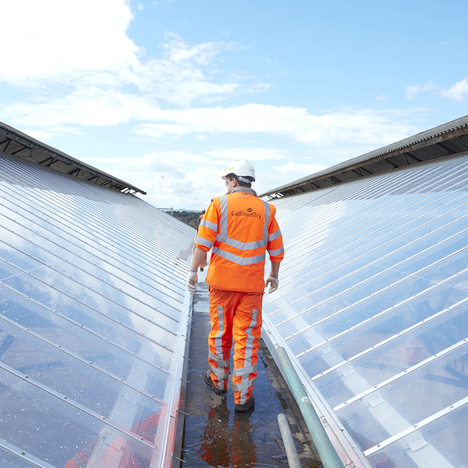 site person walking on a glass roof 