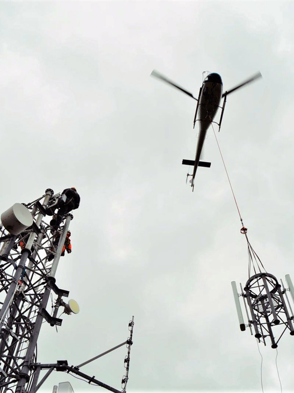 helicopter installing antenna 